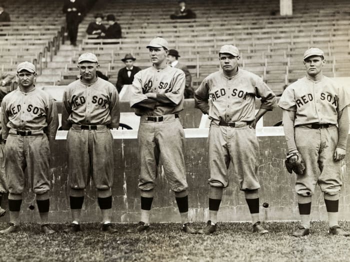Members of the Red Sox, including Babe Ruth (second from right), stand together.